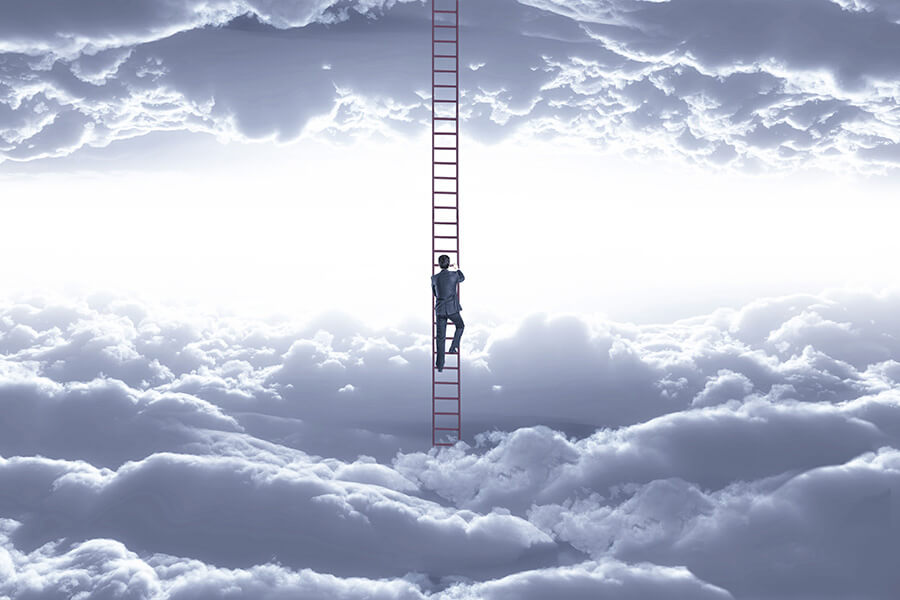 Man climbs up a ladder in the clouds